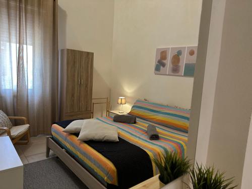 a bedroom with a large bed in a room at La Corte 22 in Marsala