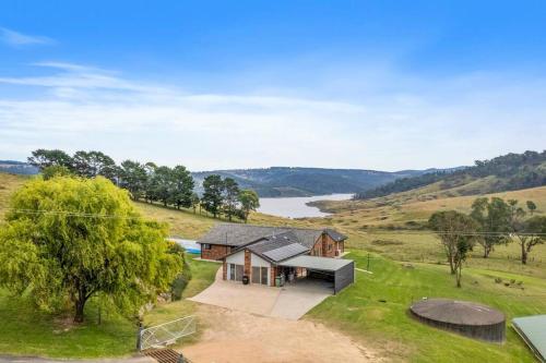an aerial view of a house on a hill at The Lakehaus at Lyell in Bowenfels