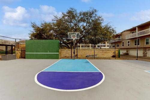an empty basketball court with a basketball hoop at Mariner Village 307 in Seabrook