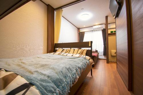 a bedroom with a bed in a room at Kyoto - apartment / Vacation STAY 168 in Kyoto
