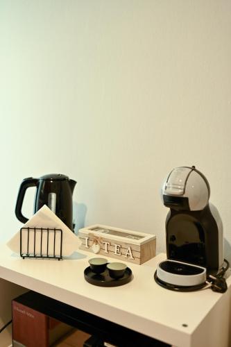 a coffee maker sitting on a counter with a coffee pot at Thessaloniki Center Aristotelous Apartment in Thessaloniki