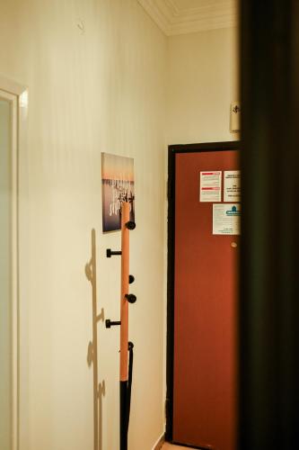 a room with a door and a sign on the wall at Thessaloniki Center Aristotelous Apartment in Thessaloniki