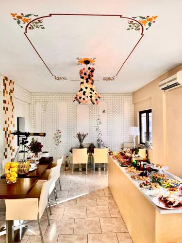 a living room with a long table and chairs at Rozmari and Spa in Agia Galini