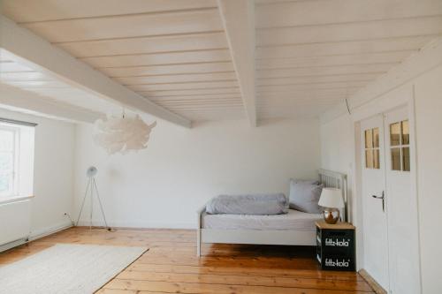 Ένα ή περισσότερα κρεβάτια σε δωμάτιο στο NordseeEstate - Lodge unter Reet mit Sauna