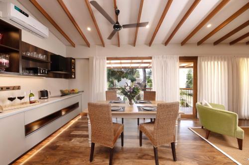 a kitchen with a dining room table and chairs at Colombo Villa Collection in Colombo