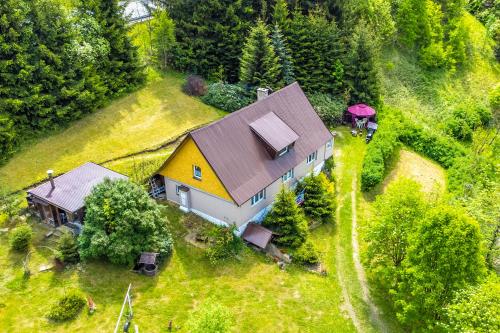 an aerial view of a house on a hill at Chalupa Kukajda in Desná