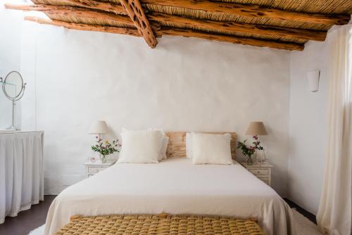 Posteľ alebo postele v izbe v ubytovaní Can Quince Balafia Ibiza Hotel - Turismo de Interior