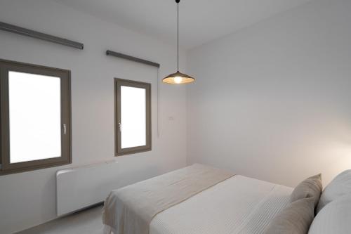 Postel nebo postele na pokoji v ubytování Rizes Villas Santorini with private pool