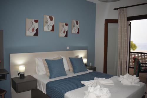 Ένα ή περισσότερα κρεβάτια σε δωμάτιο στο Asteras Apartments