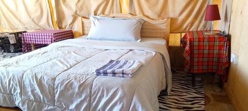 Postel nebo postele na pokoji v ubytování Esam Homestay