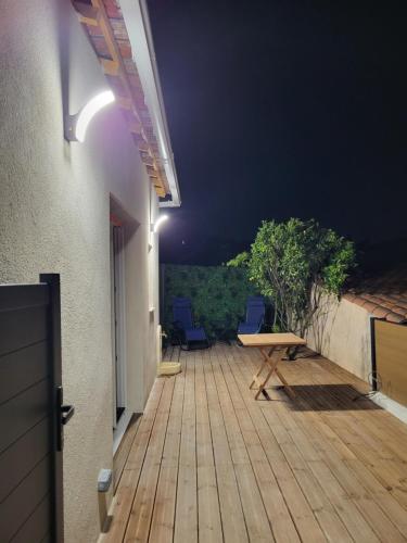 a deck with chairs and a table on a building at Studio à 400 m de la plage in Le Pradet