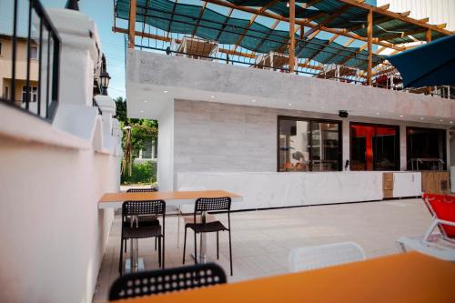 a patio with chairs and a table on a building at Belsun Hotel in Beldibi