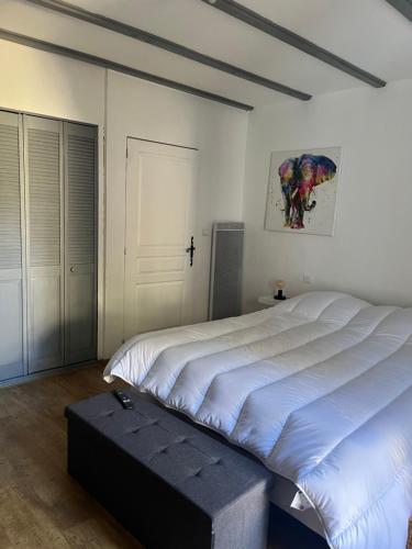 Ένα ή περισσότερα κρεβάτια σε δωμάτιο στο Gîte OSTALADA