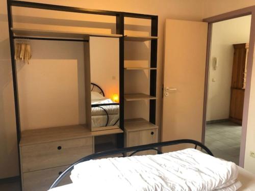 a bedroom with a bunk bed and a bedroom with a bunk bed at Duinroos C2 in Koksijde