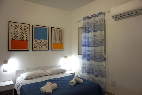 Postel nebo postele na pokoji v ubytování La Scala del Moro Rooms - Dolce Risveglio