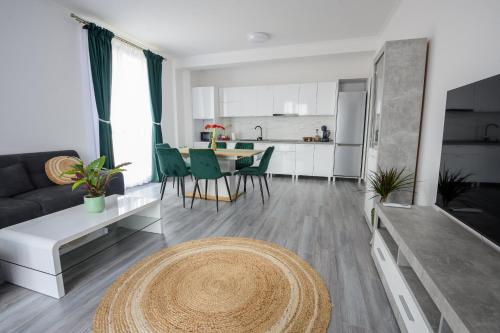 a living room with a couch and a table at Apartament Radiana in Baile Felix