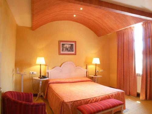Säng eller sängar i ett rum på Hotel San Camilo