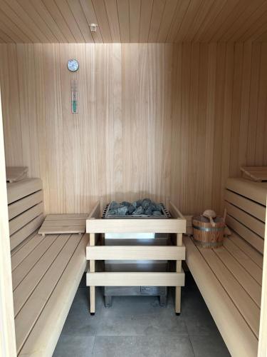 a sauna with a bench in the inside of it at Faro Greenpark, Cadzand-Bad APP 07 in Cadzand