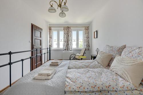a living room with a bed and a couch at Apartament Gdańsk in Gdańsk