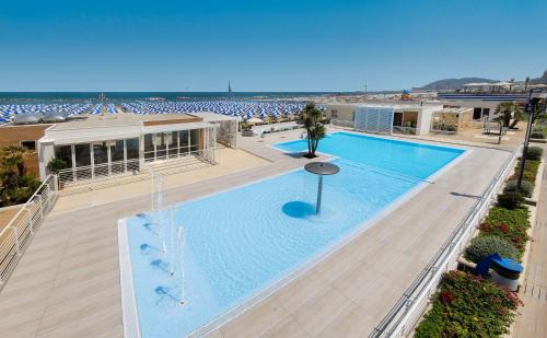 an overhead view of a swimming pool at a beach at Hotel Antares in Cattolica