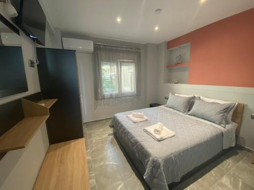 Postel nebo postele na pokoji v ubytování Thalassa Apartment