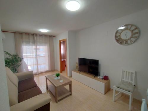 A television and/or entertainment centre at ACV - Costa Marina I-1ª linea planta 2 sur