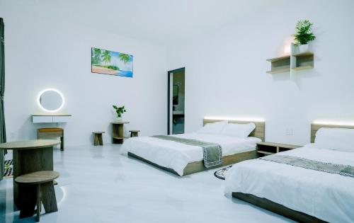 Ένα ή περισσότερα κρεβάτια σε δωμάτιο στο VILLA MINH TRANG - ĐẢO PHÚ QUÝ