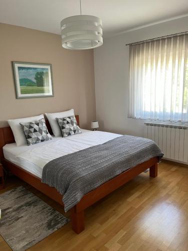Postel nebo postele na pokoji v ubytování Apartman Dada
