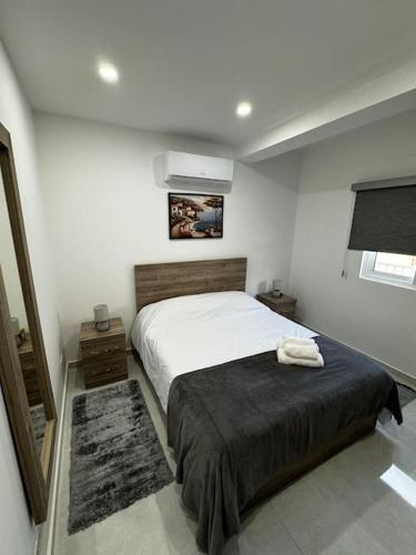 Ένα ή περισσότερα κρεβάτια σε δωμάτιο στο Moonlight Penthouse in Gzira
