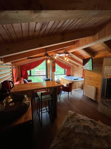 a room with a wooden table and chairs in a room at Ayder Paradise Otel in Ayder Yaylasi