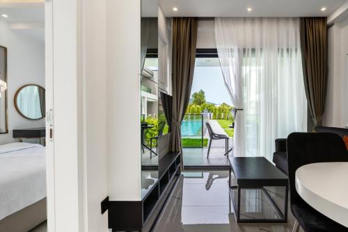a hotel room with a bed and a balcony at Edem Apartments in Kemer