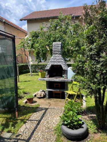 a backyard with a stone oven in a yard at Apartment Ramdedovic1 in Sarajevo