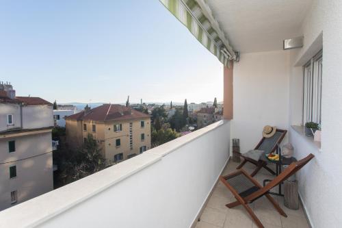 an apartment balcony with a view of a city at Makaria in Split