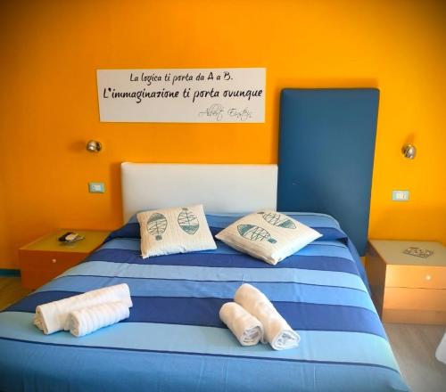 Кровать или кровати в номере La Favorita Hotel