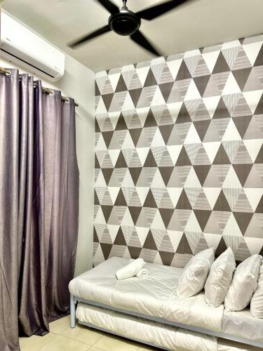 Кровать или кровати в номере The Amore Homestay Klebang, Melaka