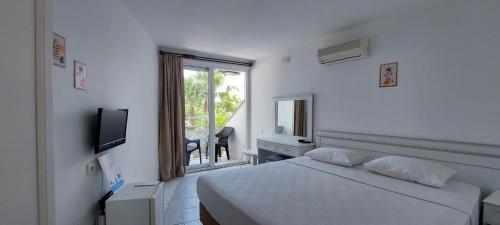Postel nebo postele na pokoji v ubytování UK Hotel Kiriş