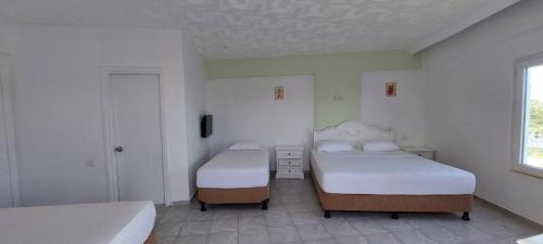 Кровать или кровати в номере UK Hotel Kiriş