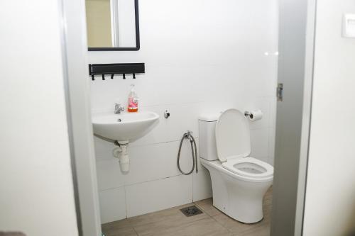 a bathroom with a toilet and a sink at KLIA Airport Homestay 8 in Sepang