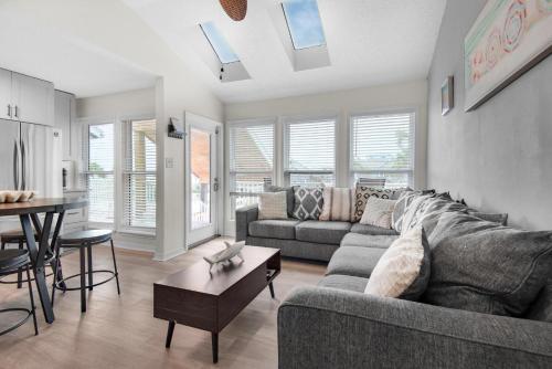 a living room with a couch and a table at LaBahia 224 in Pensacola Beach