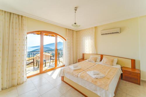 Ένα ή περισσότερα κρεβάτια σε δωμάτιο στο Villa Meltem