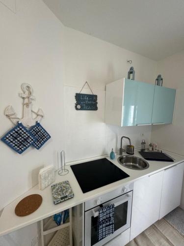 a kitchen with a sink and a counter top at Appartamento Fronte Mare in Fossacesia