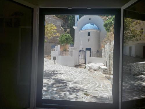 a view from a window of a building at Mesa Vrisi in Karpathos Town