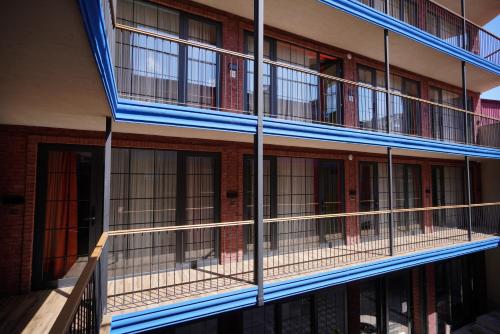 a building with balconies on the side of it at Station 22 Hotel in Batumi