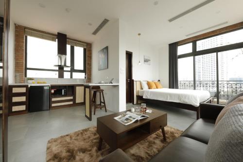 Postel nebo postele na pokoji v ubytování Mersey Central Hanoi Apart'Hotel