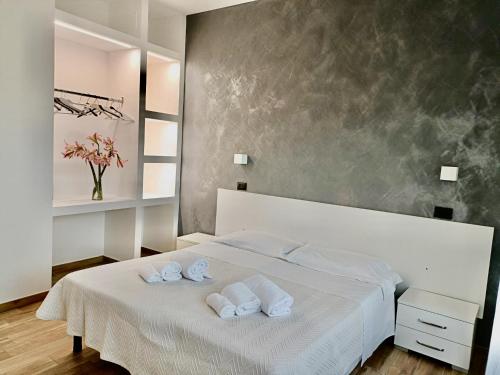 Postel nebo postele na pokoji v ubytování Hotel Il Moro