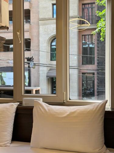 a pillow sitting in front of a window at Centroom boutique hotel in Yerevan