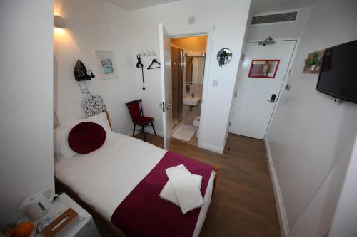 TV a/nebo společenská místnost v ubytování City London Hotel