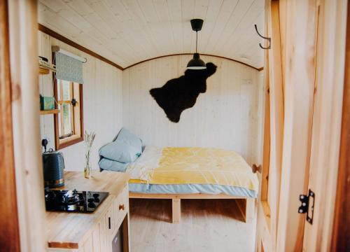 Postel nebo postele na pokoji v ubytování Oak Hut Wiveliscombe