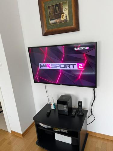 a flat screen tv sitting on top of a table at Apartman Dada in Krapinske Toplice