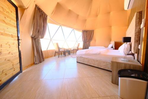 Ένα ή περισσότερα κρεβάτια σε δωμάτιο στο Adel rum camp bubbles